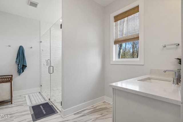 bathroom with vanity and walk in shower