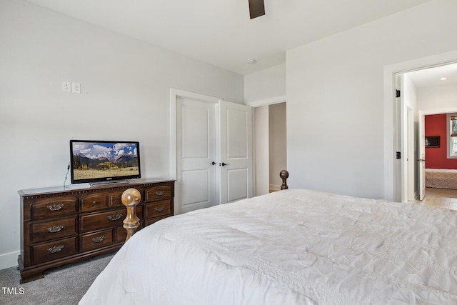 carpeted bedroom with ceiling fan