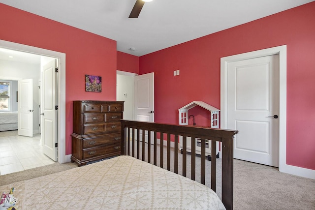 bedroom with ceiling fan and light colored carpet