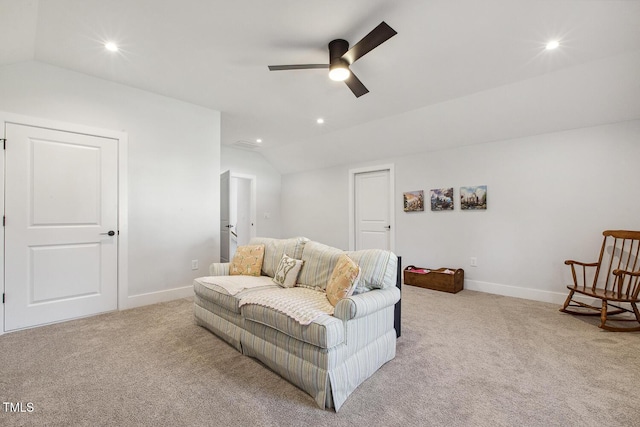 living room featuring light carpet, lofted ceiling, and ceiling fan