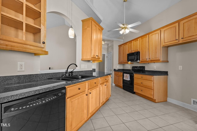 kitchen featuring light tile patterned floors, sink, ceiling fan, black appliances, and dark stone counters