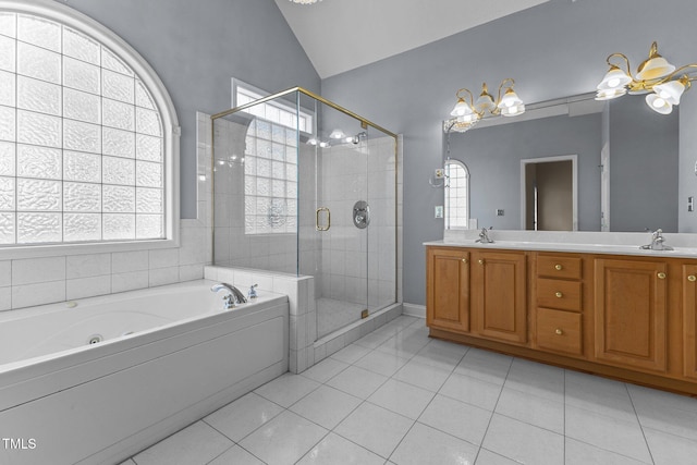 bathroom featuring tile patterned flooring, vanity, lofted ceiling, and plus walk in shower