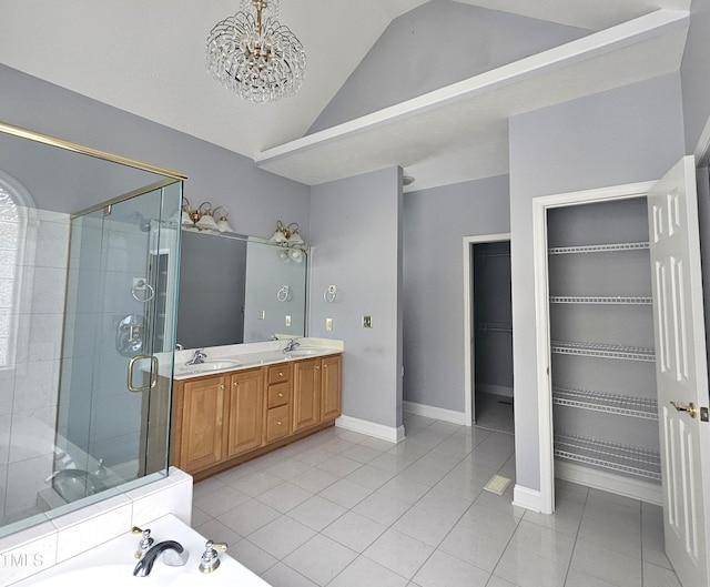 bathroom featuring vaulted ceiling, independent shower and bath, tile patterned flooring, vanity, and a notable chandelier