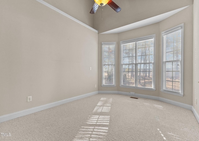 unfurnished room with vaulted ceiling, ceiling fan, and carpet floors