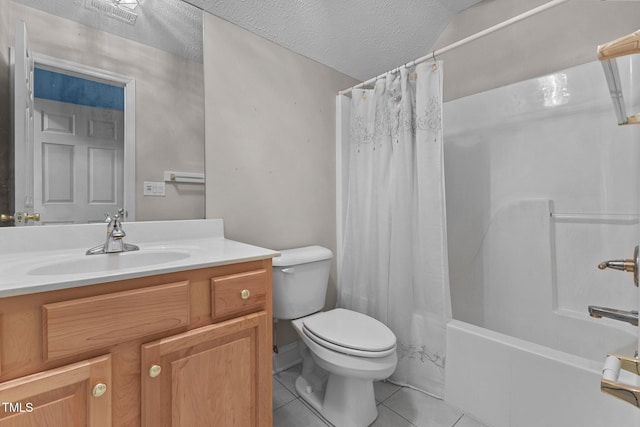 full bathroom featuring shower / tub combo, vanity, a textured ceiling, tile patterned floors, and toilet