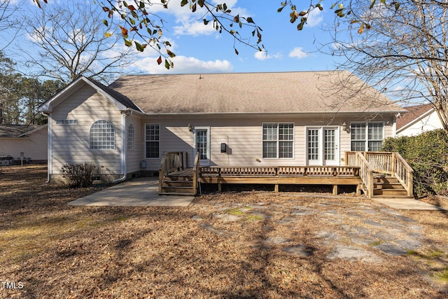 back of property with a patio and a deck