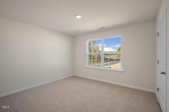 unfurnished room featuring carpet flooring