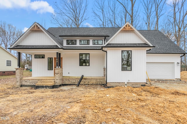 view of front of house featuring a garage and covered porch