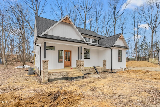 view of front of house with central AC unit and a porch