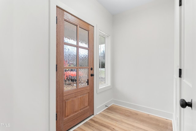 doorway with light hardwood / wood-style floors