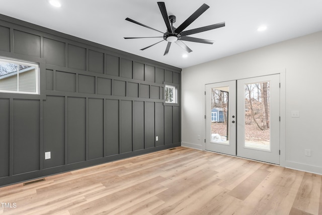 interior space with ceiling fan, french doors, and light hardwood / wood-style flooring