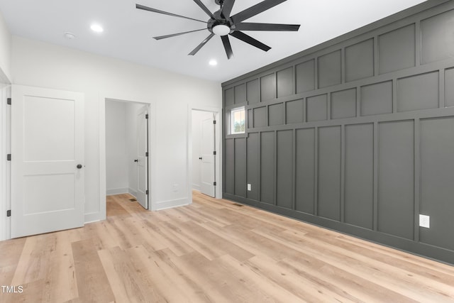 unfurnished bedroom featuring ceiling fan and light hardwood / wood-style floors