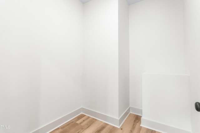 laundry room featuring light hardwood / wood-style floors