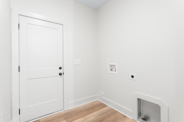 laundry room with hookup for a washing machine, electric dryer hookup, and light wood-type flooring