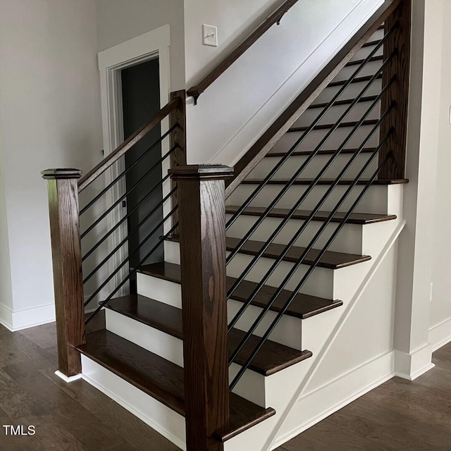 stairs with wood-type flooring