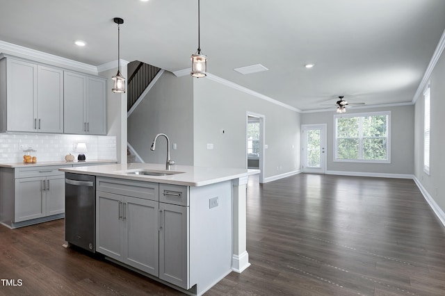 kitchen featuring gray cabinets, hanging light fixtures, sink, and a kitchen island with sink