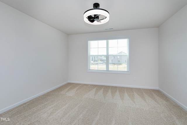 empty room featuring carpet floors