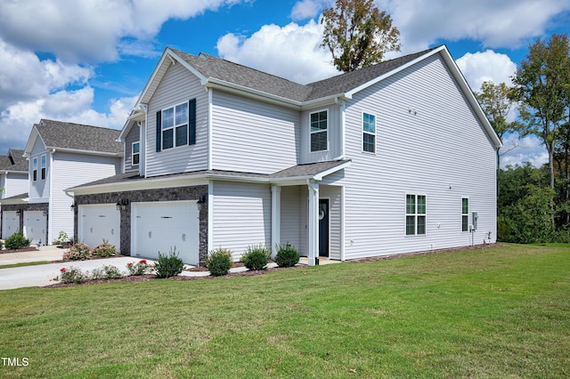 view of front facade with a garage and a front lawn