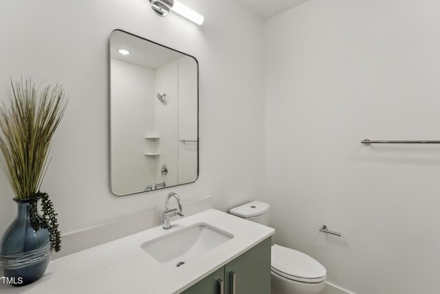 bathroom with toilet and vanity