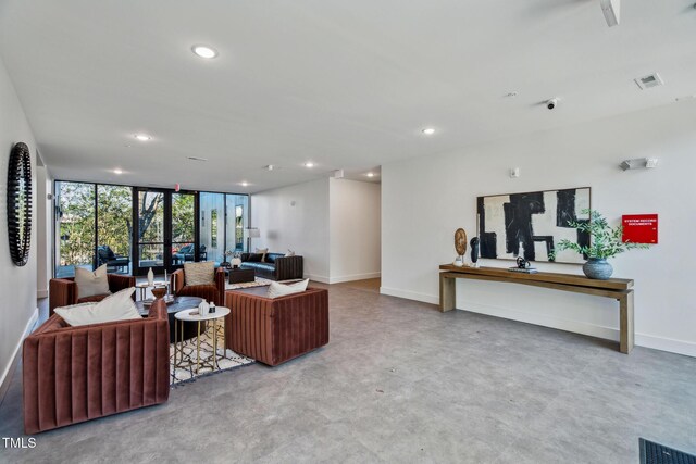 living area featuring visible vents, recessed lighting, and baseboards