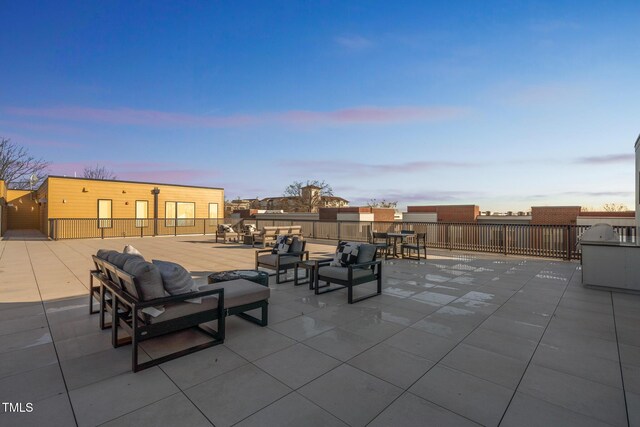 patio terrace at dusk with an outdoor hangout area