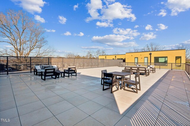 view of patio with an outdoor living space, outdoor dining space, and fence