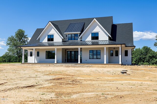 6509 Zebulon Rd, Wake Forest, NC 27587 - modern farmhouse featuring a standing seam roof, metal roof, and covered porch