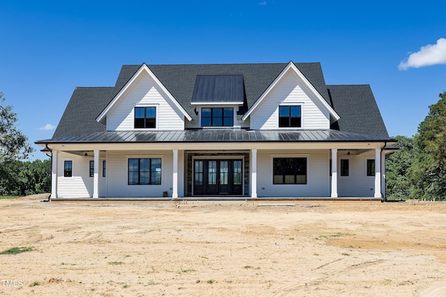 6509 Zebulon Rd, Wake Forest, NC 27587 - modern inspired farmhouse with a standing seam roof, a porch, and metal roof