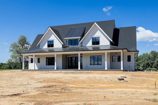 6509 Zebulon Rd, Wake Forest, NC 27587 - modern inspired farmhouse with a standing seam roof, a porch, metal roof, and a shingled roof
