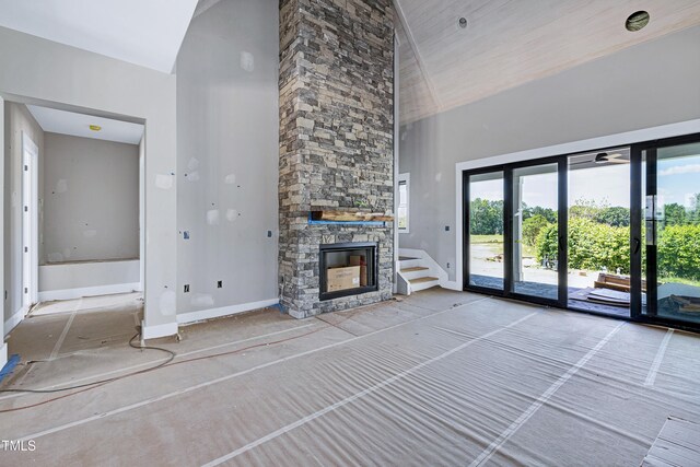 6509 Zebulon Rd, Wake Forest, NC 27587 - unfurnished living room with baseboards, high vaulted ceiling, and a fireplace