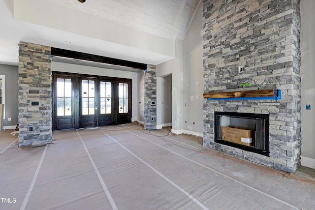 6509 Zebulon Rd, Wake Forest, NC 27587 - entryway with french doors, a stone fireplace, and baseboards