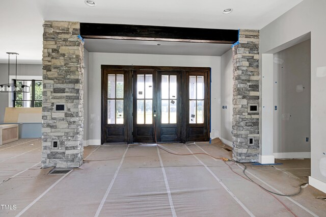 6509 Zebulon Rd, Wake Forest, NC 27587 - foyer with ornate columns, beam ceiling, baseboards, and french doors