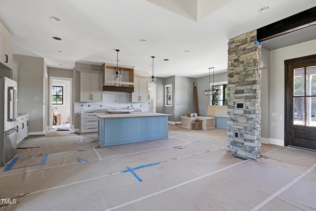 6509 Zebulon Rd, Wake Forest, NC 27587 - kitchen featuring high end fridge, light countertops, baseboards, and hanging light fixtures