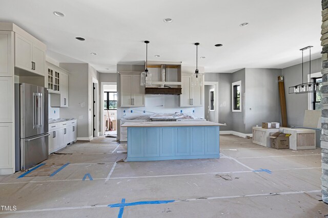 6509 Zebulon Rd, Wake Forest, NC 27587 - kitchen featuring high quality fridge, baseboards, a kitchen island, light countertops, and hanging light fixtures