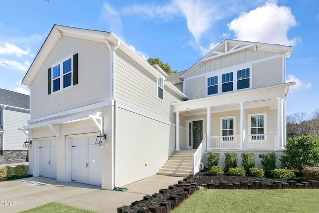 view of front facade featuring a porch, a garage, stairs, concrete driveway, and board and batten siding