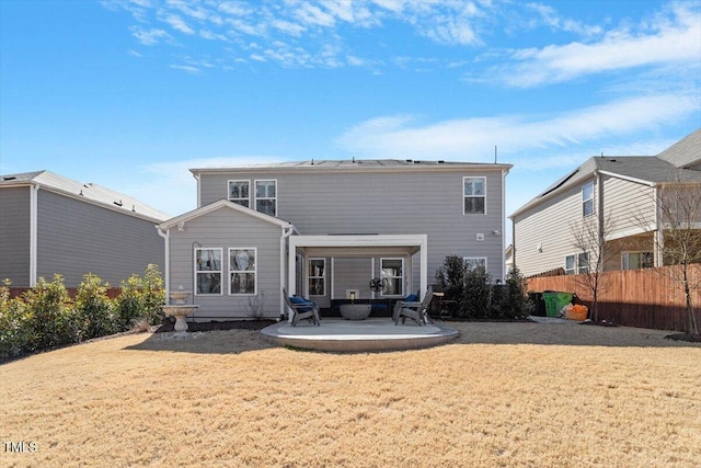 rear view of property with a patio and a yard