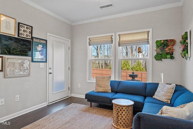 living room with hardwood / wood-style flooring and ornamental molding