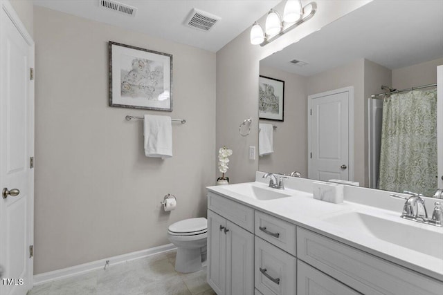 bathroom with vanity, tile patterned flooring, toilet, and a shower with shower curtain