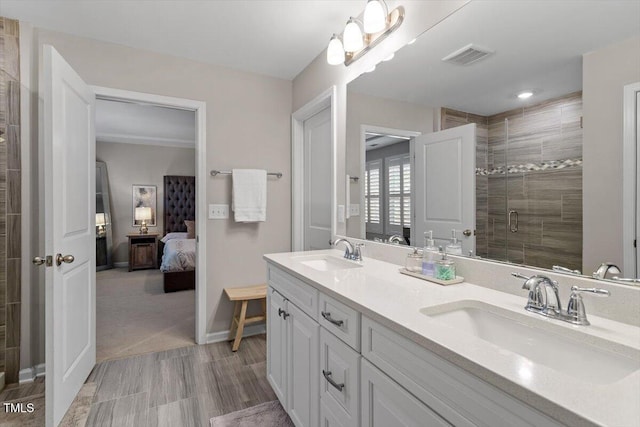 bathroom featuring walk in shower and vanity