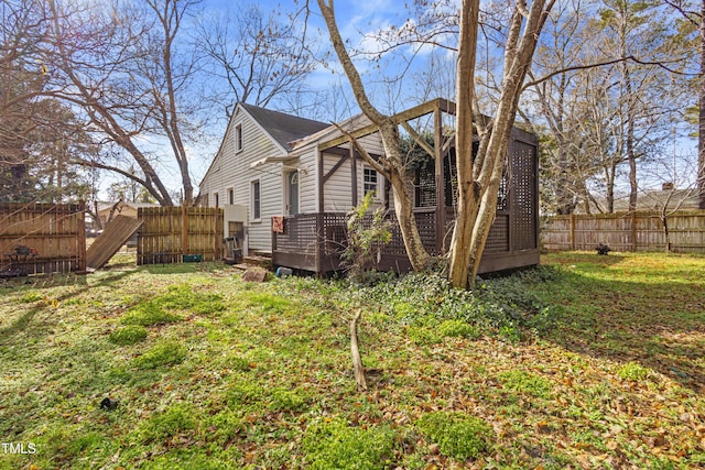 view of side of home with a lawn