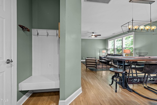 dining room featuring crown molding, hardwood / wood-style flooring, and ceiling fan