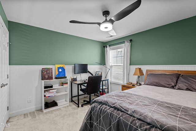 bedroom with ceiling fan and light colored carpet