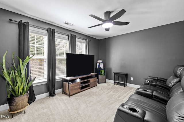 living room featuring light carpet and ceiling fan