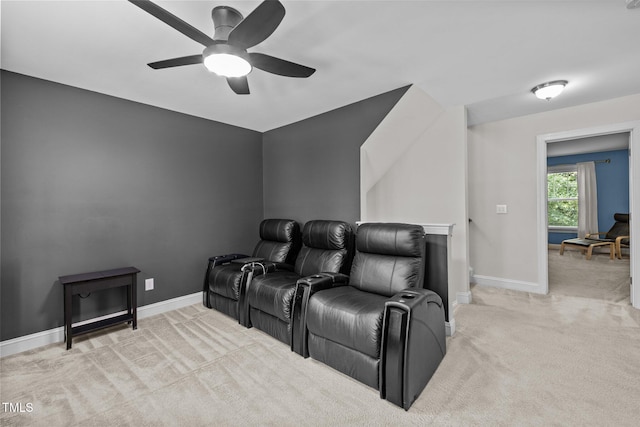 home theater room with light carpet and ceiling fan