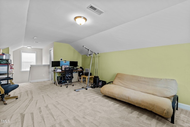 carpeted office featuring lofted ceiling