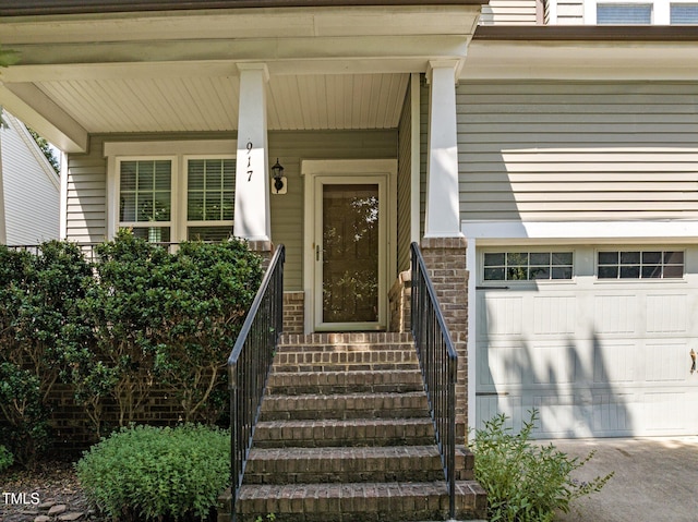 doorway to property with a garage