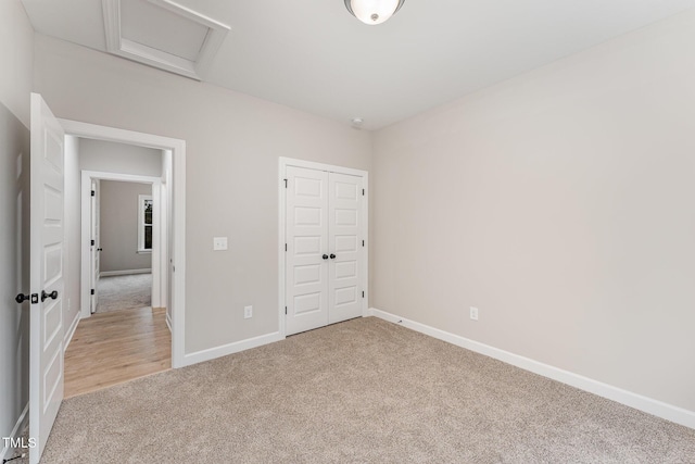 unfurnished bedroom featuring a closet and carpet