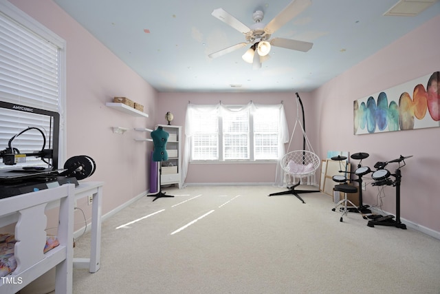 miscellaneous room featuring ceiling fan and light colored carpet