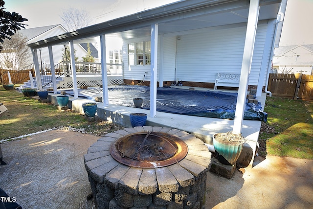 view of patio featuring an outdoor fire pit