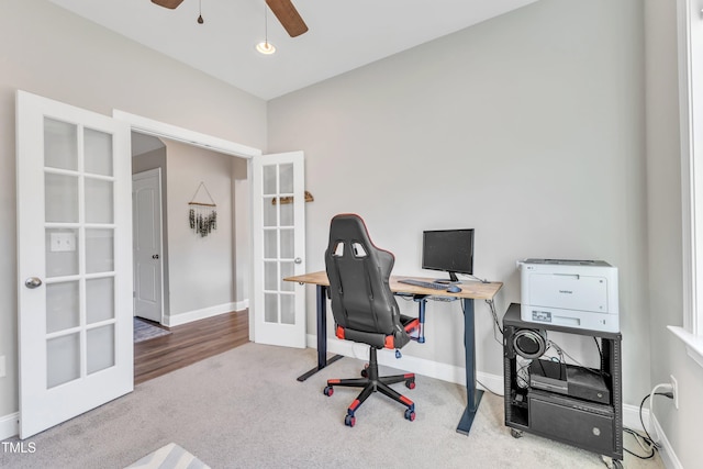 office with carpet floors, ceiling fan, and french doors